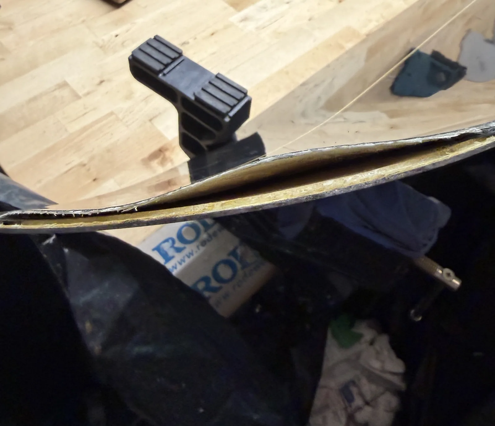 Separated snowboard layers before delamination repair