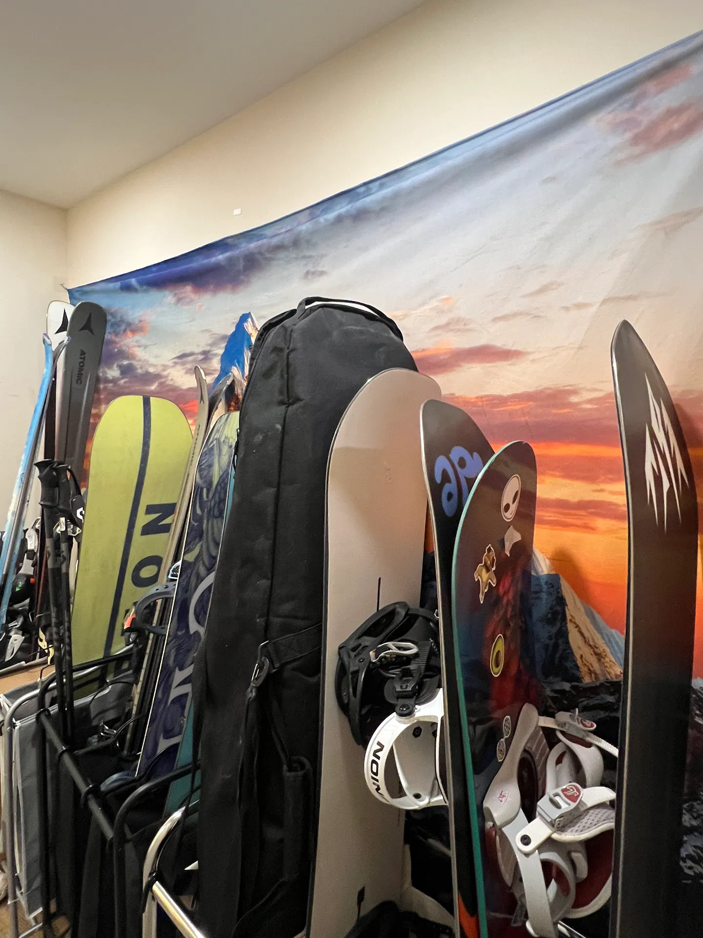 Skis and snowboards stored in the workshop